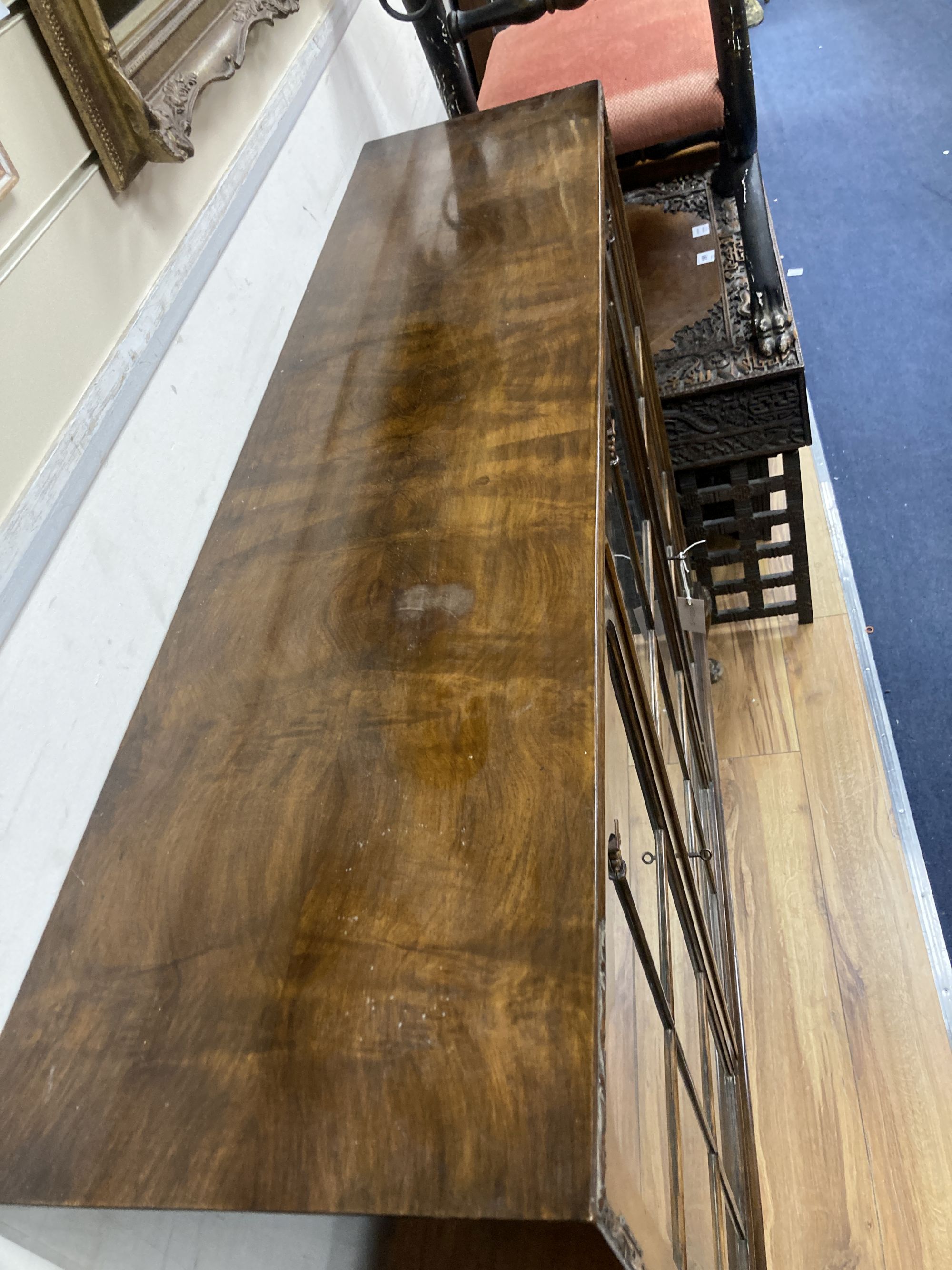 A Queen Anne revival burr walnut three door glazed bookcase, width 132cm, depth 33cm, height 118cm